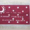 Crescent moon and stars on red flag with text in white