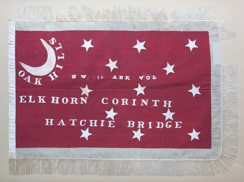 Crescent moon and stars on red flag with text in white