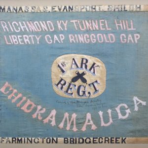Flag with crossed cannons on white "first Arkansas regiment" logo on blue background with white and black text