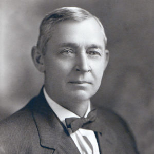 Portrait white man in suit and bow tie