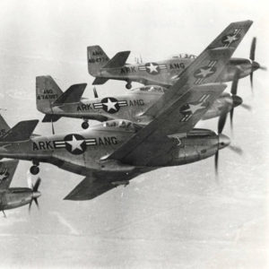 Four propeller-driven fighters planes flying in formation