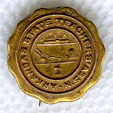 gold lapel pin with image of steamboat and field plow