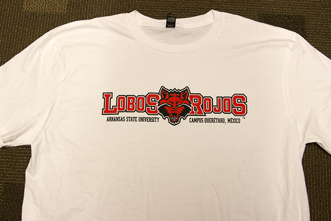 White shirt with red and black "Lobos Rojos" in its center