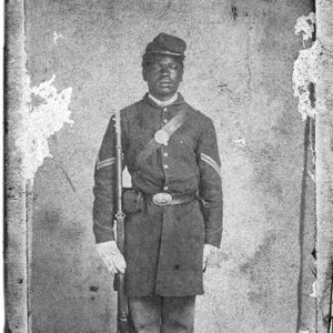 African-American man in military dress holding rifle