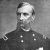 older White man with long mustache in military uniform