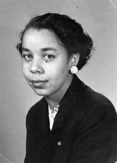 Young African-American woman with short hair and earrings