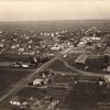 Town buildings and streets as seen from above with photo watermark saying "Downing's Studio Stuttgart, Arkansas"