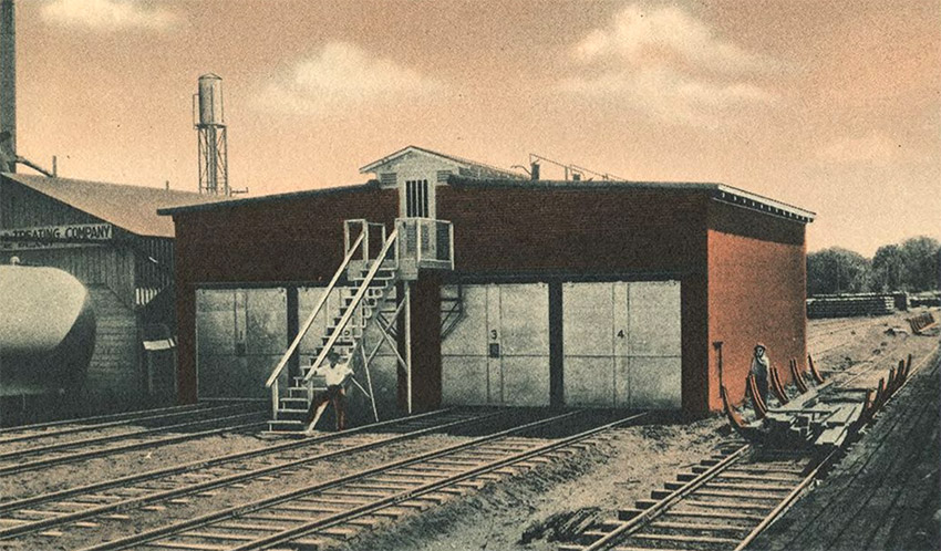 Industrial buildings with railroad tracks in front of them