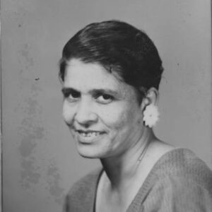 Young African-American woman smiling with short hair and large earrings