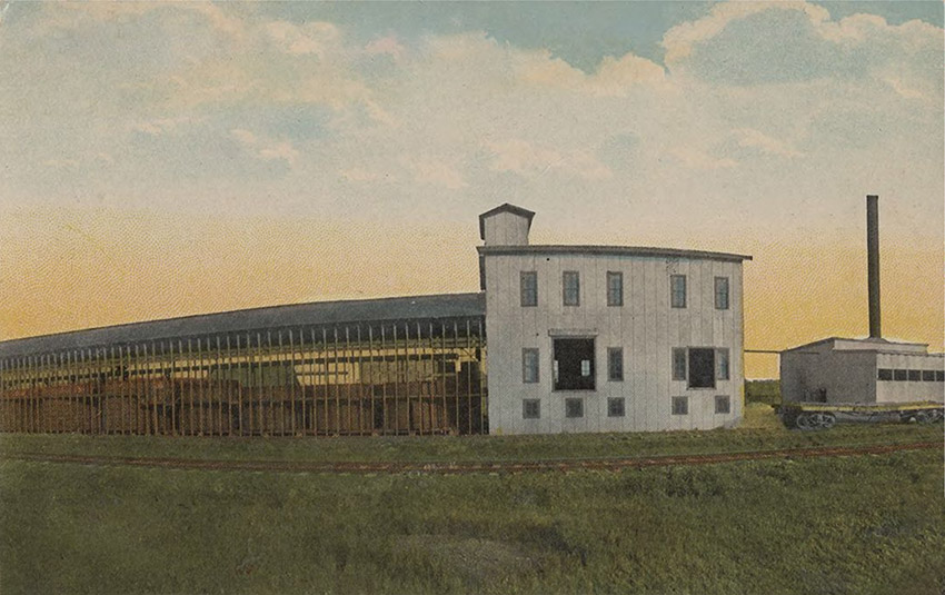 Long multistory building adjacent to railroad track