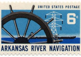 Stamp "United States Postage Arkansas River Navigation Six cents" showing ships wheel, barge, electricity pylon