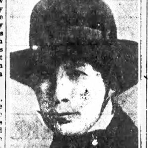 Framed picture of white woman with wide brimmed hat and article in newspaper