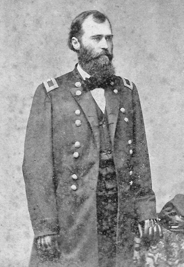 white man with beard in military regalia poses standing
