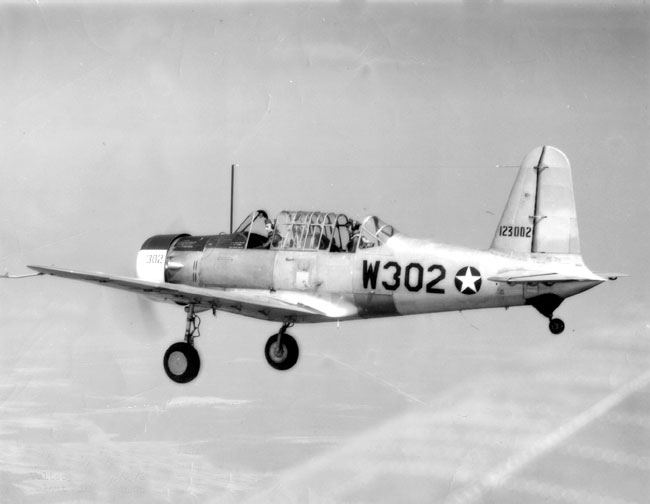 Propeller-driven airplane in flight with landing gear engaged
