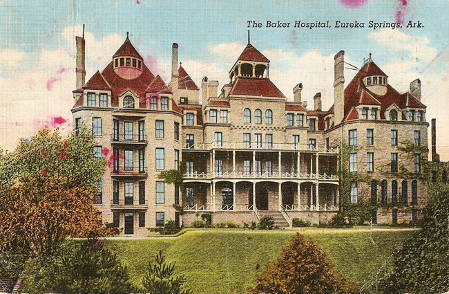 postcard of multistoried light building with gabled roofs and chimneys "The Baker Hospital Eureka Springs Arkansas"
