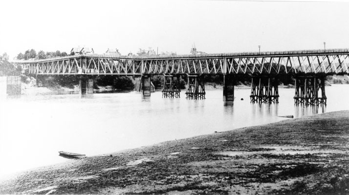 Steel railroad bridge across a river