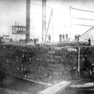 Steamboat loaded with cotton bales at port