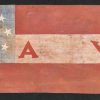 Red white and blue flag with stars and "A VOL" stitched on white stripe