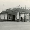 Shell gas station with canopy and gas pumps with car