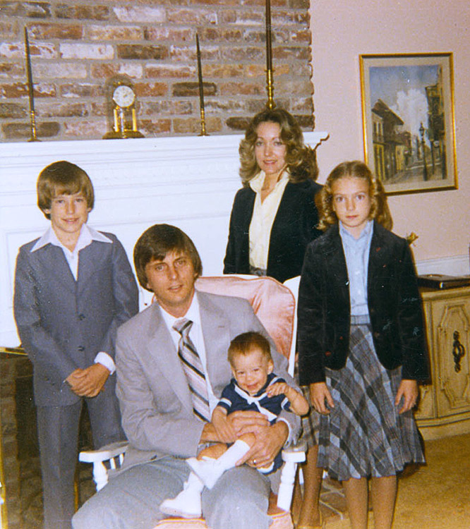 White man woman and children in living room