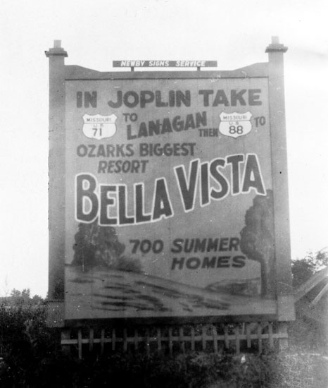 Large sign advertising Bella Vista including directions