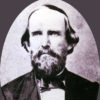 portrait of white man with beard in suit and tie