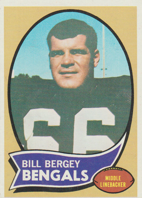 White man in football uniform with "Bill Bergey Bengals" on banner below him and foot ball with "Middle Linebacker" on it