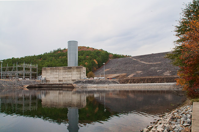 Concrete dam and buildings with power station on water