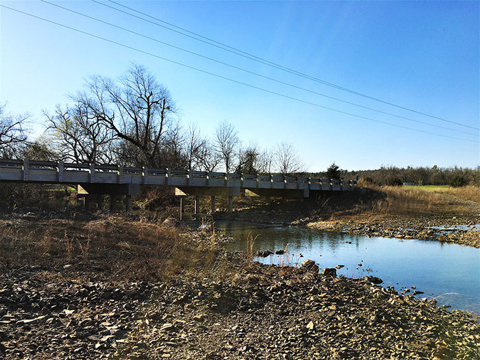 Concrete bridge over shallow creek