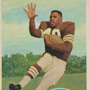 African-American man in mid air with football and "Bobby Mitchell Cleveland Browns Halfback" written in blue circle on card