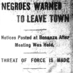 "Negroes warned to leave town" newspaper clipping