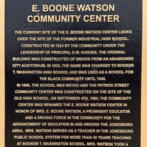 "E Boone Watson Community Center" plaque with gold lettering and borders