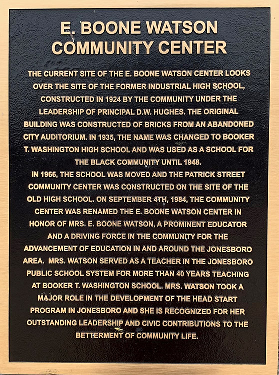 "E Boone Watson Community Center" plaque with gold lettering and borders