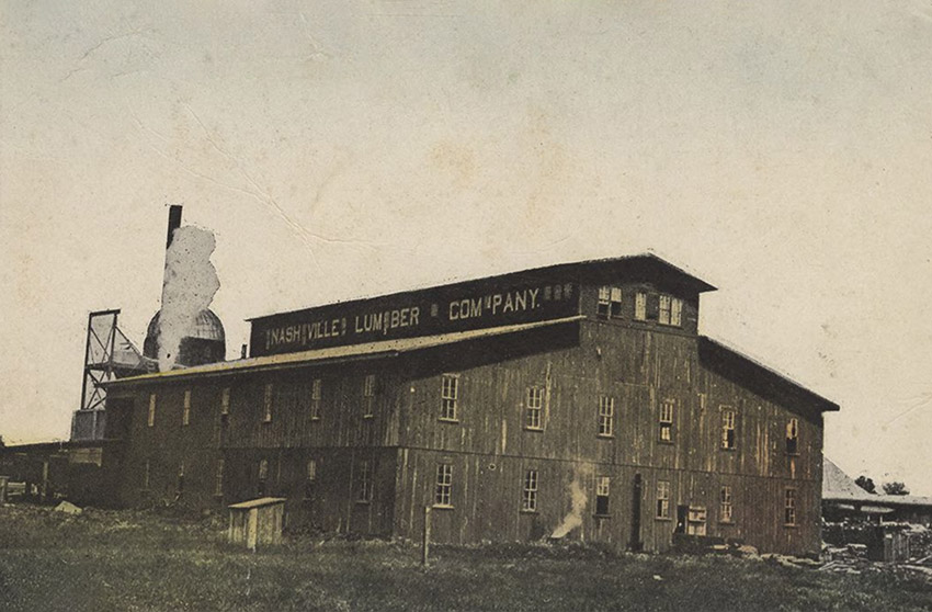 Large industrial building displaying "Nashville Lumber Company" sign
