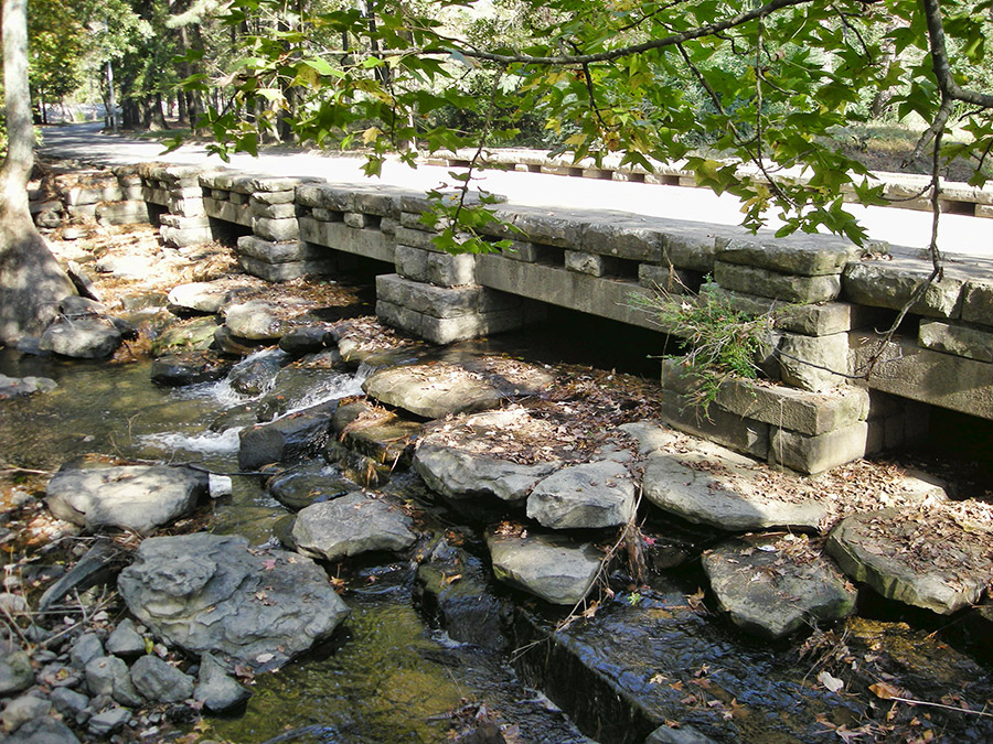 Concrete and stone bridge over creek