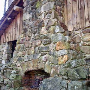 Close-up of outdoor stone and brick fireplace