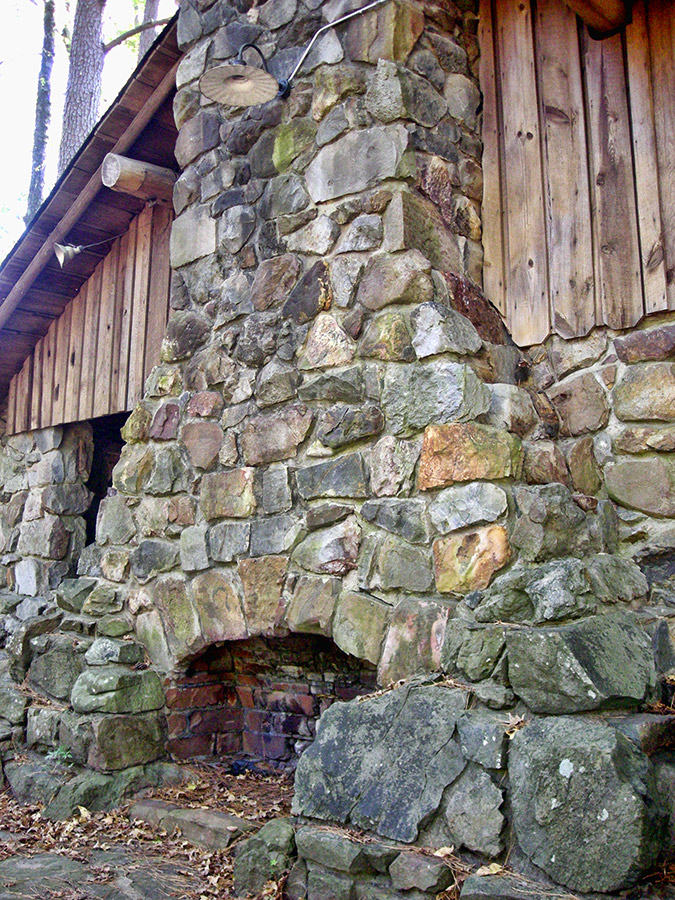 Close-up of outdoor stone and brick fireplace