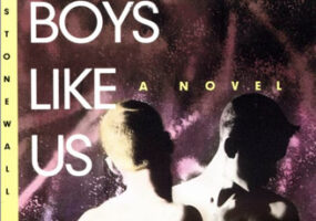 Cover of book "Boys Like Us." featuring two shirtless white men facing each other in front of purple background