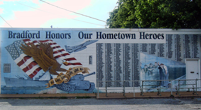 mural featuring American flag and bald eagle and tank with "Bradford Honors Our Hometown Heroes" above list of names