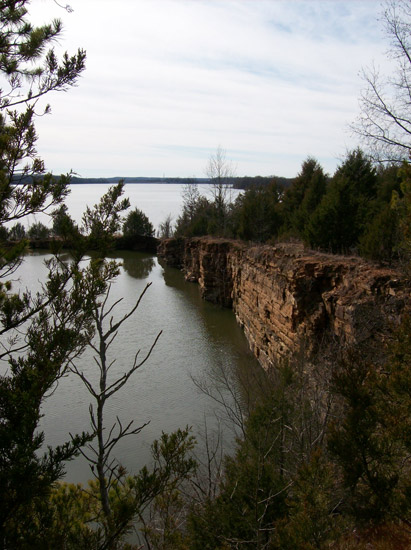 Lake with rock wall and trees