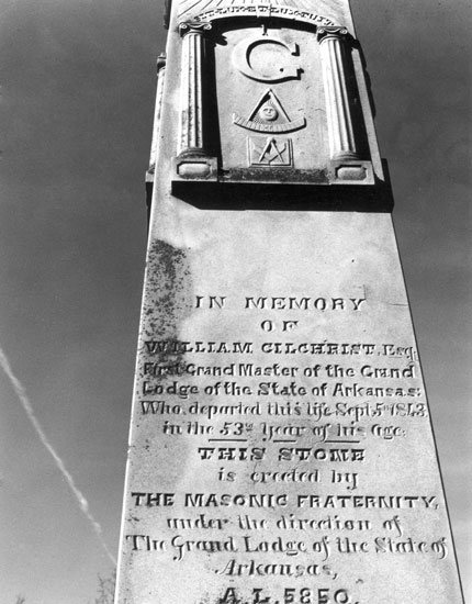 Stone monument with Masonic symbols and funereal inscription