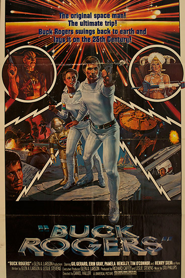 White man and woman in costume with gun and futuristic ships and characters on movie poster