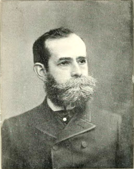 White man with thick beard and mustache in military uniform