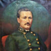 White man with mustache in blue military uniform with gold buttons