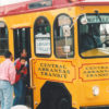 People boarding trolley labeled "Central Arkansas Transit"