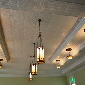 Decorative tile ceiling with lighting fixtures