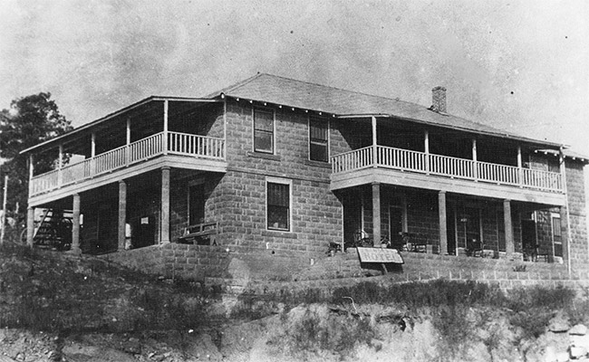 Two-story building with covered porches and balconies