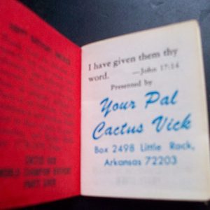 Close-up of small red book from "Your Pal Cactus Vick" on table