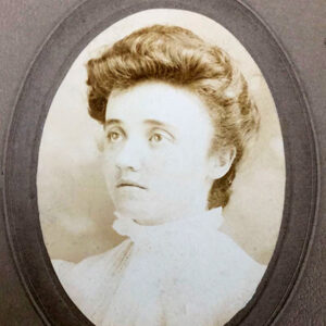 Young white woman in oval frame