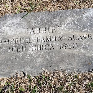 Engraved flat gravestone on grass "Abbie Campbell Family Slave Died Circa 1860"